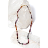 La Vie en Rose necklace composed of faceted multicolor spinel rondelles, secured with a 14-karat gold clasp and revealing a fluid interplay of soft rose, mauve, and earthy tones.