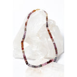 La Vie en Rose necklace with faceted multicolor spinel rondelles, secured with a 14-karat gold clasp and showcasing a fluid blend of rose, mauve, and warm neutral tones.