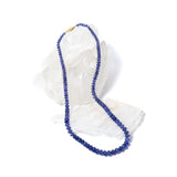 Violet Blue necklace composed of high-quality graduated tanzanite stones, finished with a 14-karat gold clasp and revealing a deep, luminous violet-blue tone with refined elegance.