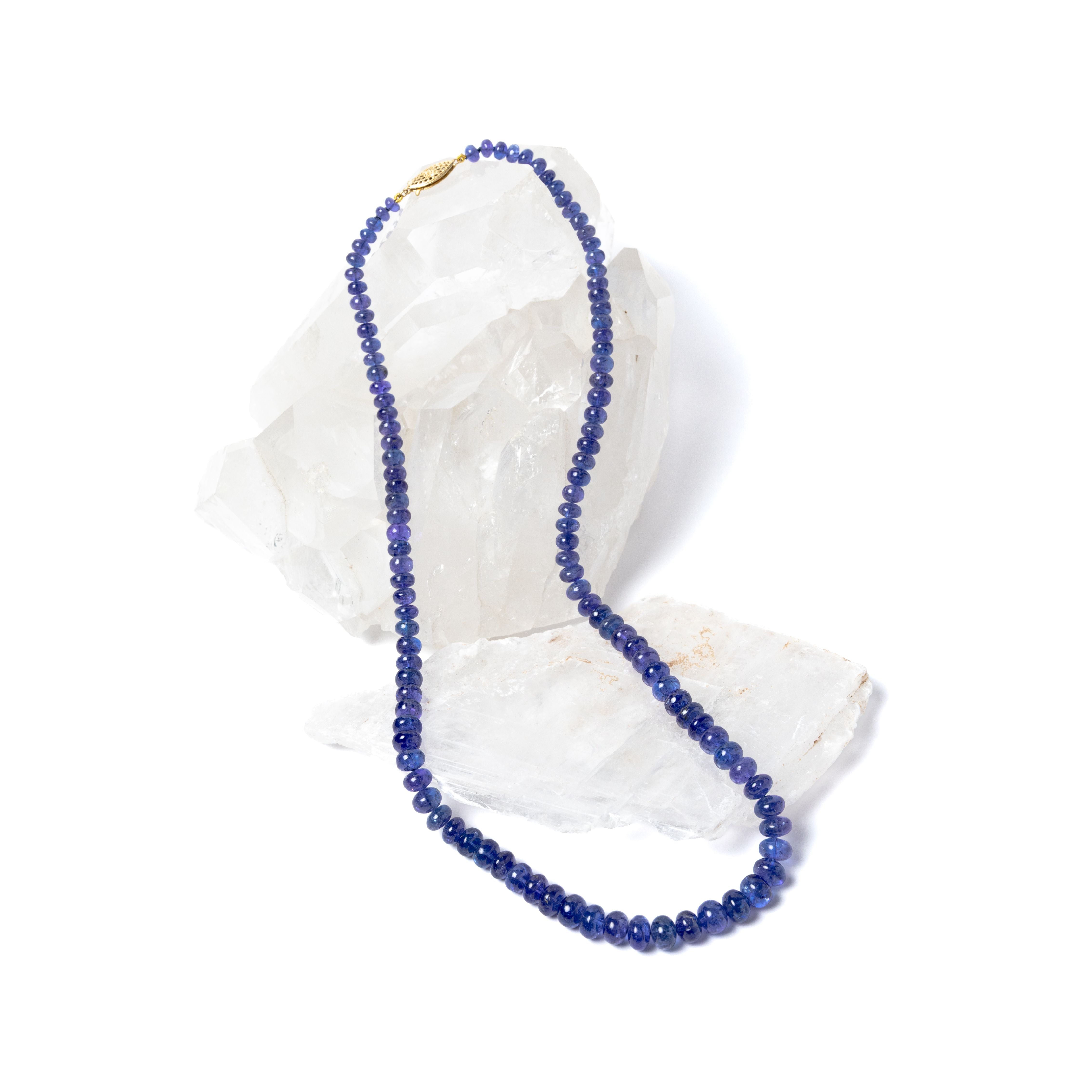 Violet Blue necklace composed of high-quality graduated tanzanite stones, finished with a 14-karat gold clasp and revealing a deep, luminous violet-blue tone with refined elegance.
