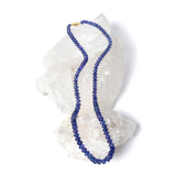 Violet Blue necklace featuring high-quality graduated tanzanite stones arranged in a continuous strand, showcasing depth of color and fluid elegance.