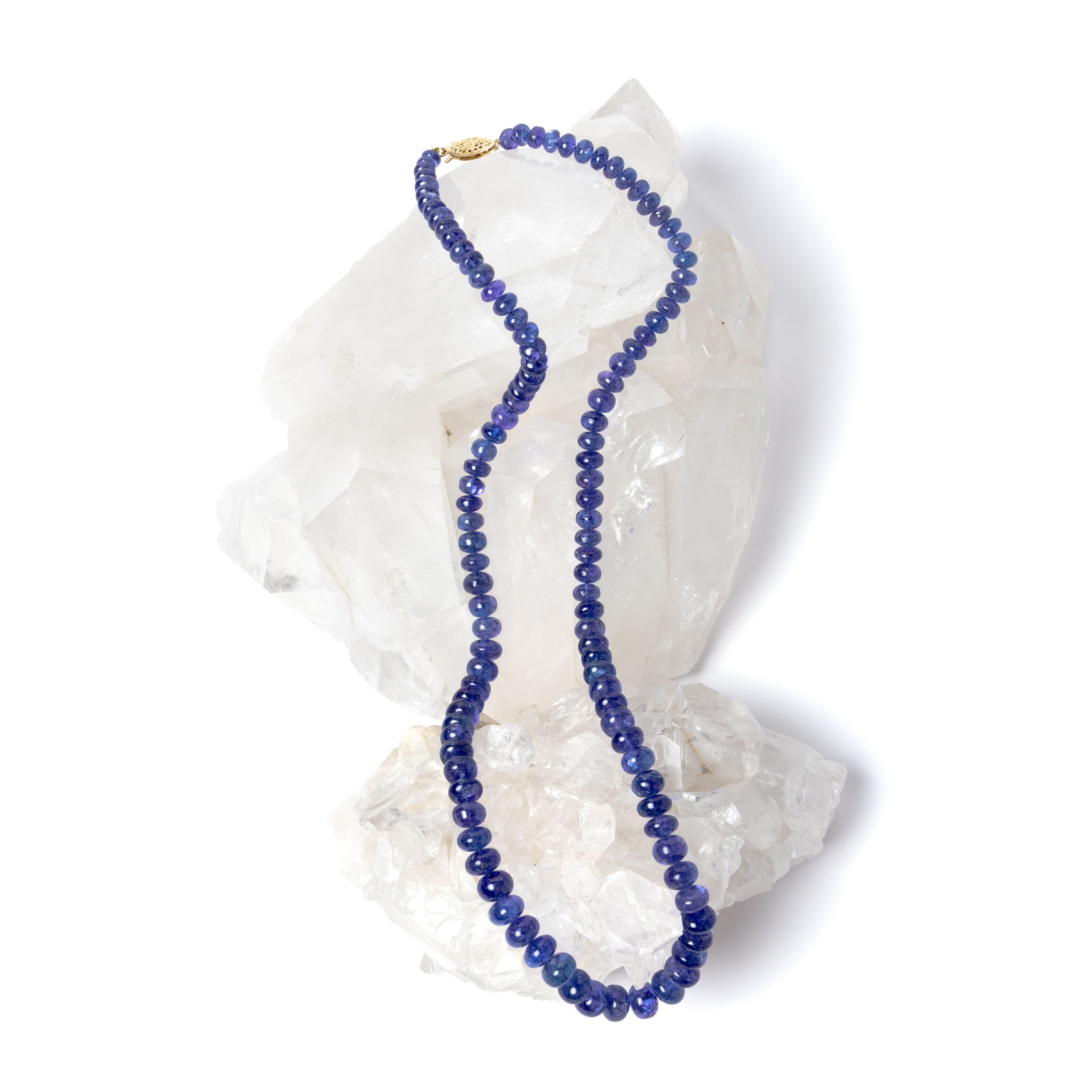 Violet Blue necklace featuring high-quality graduated tanzanite stones arranged in a continuous strand, showcasing depth of color and fluid elegance.