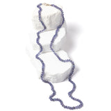 Misty Blue tanzanite necklace featuring approximately 85 carats of faceted rondelle gemstones in soft blue, lavender, and gray tones, individually knotted in a fluid 35-inch strand with a sterling silver clasp