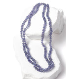 Tanzanite Misty Blue necklace styled as a double strand, highlighting its versatility and graceful drape, with individually knotted faceted rondelles creating a balanced, elegant silhouette