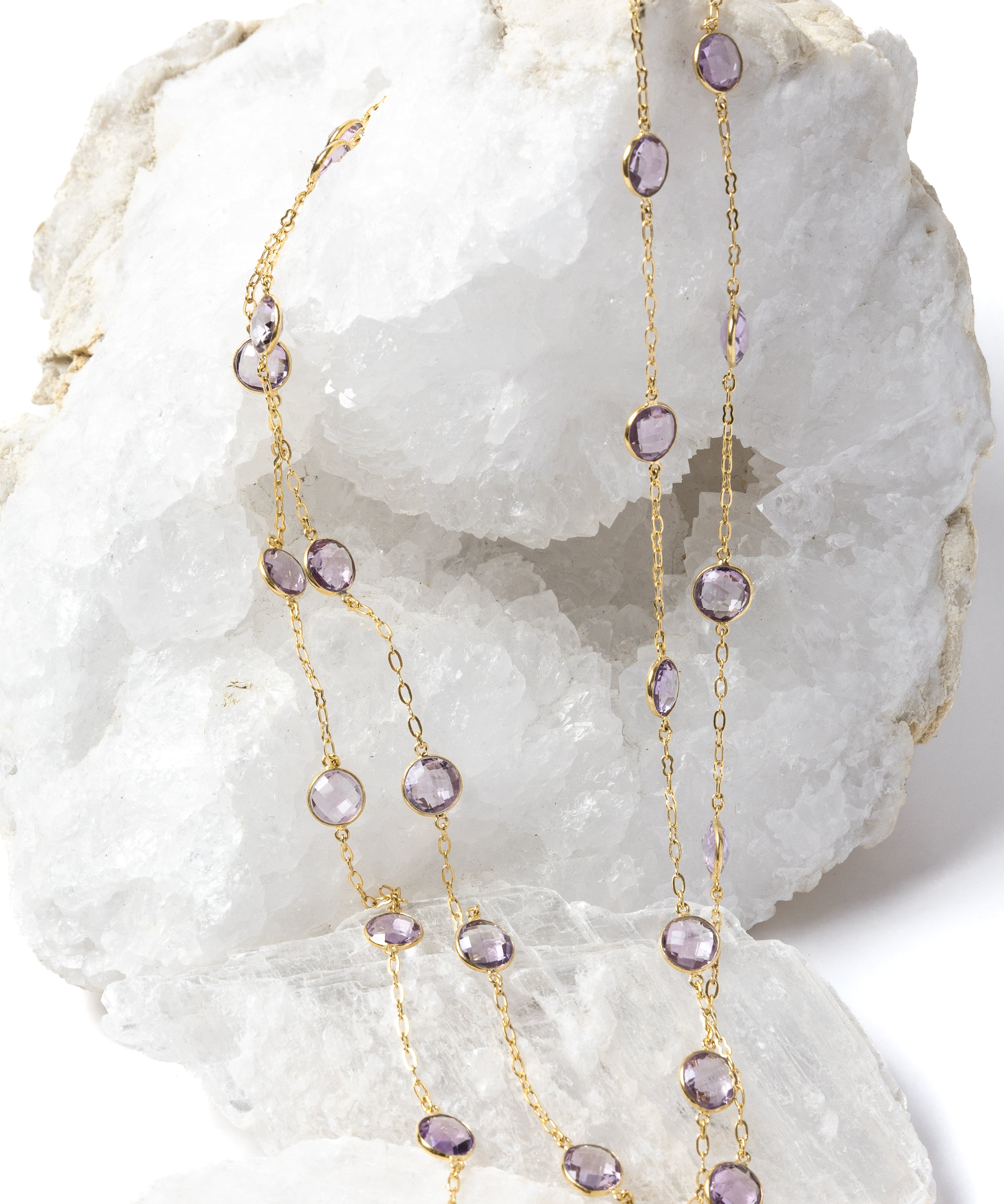 
Violet Mist gold station necklace with clear, translucent lavender amethyst stones, styled in two strands to showcase its versatile, layered wear.