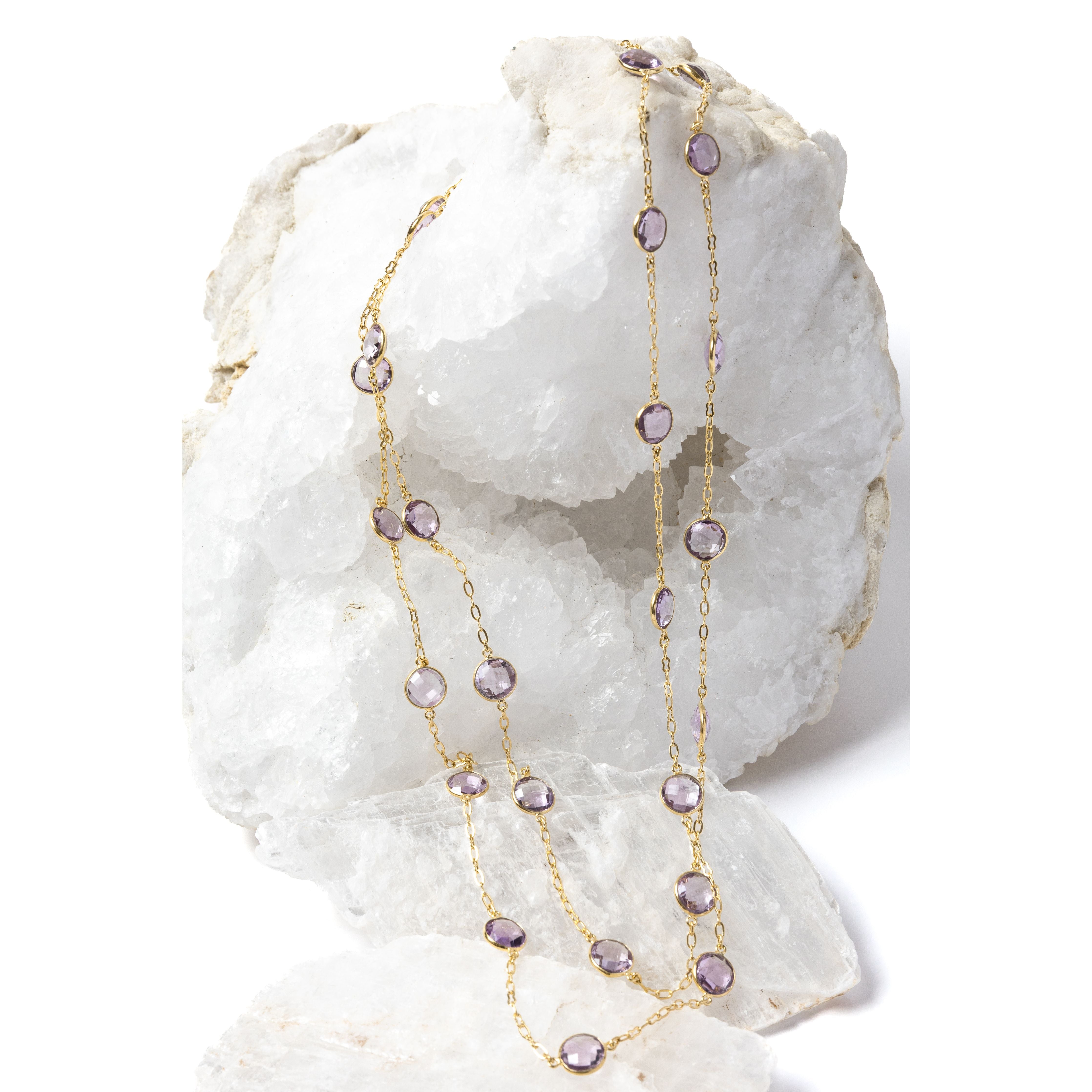 
Violet Mist gold station necklace with clear, translucent lavender amethyst stones, styled in two strands to showcase its versatile, layered wear.