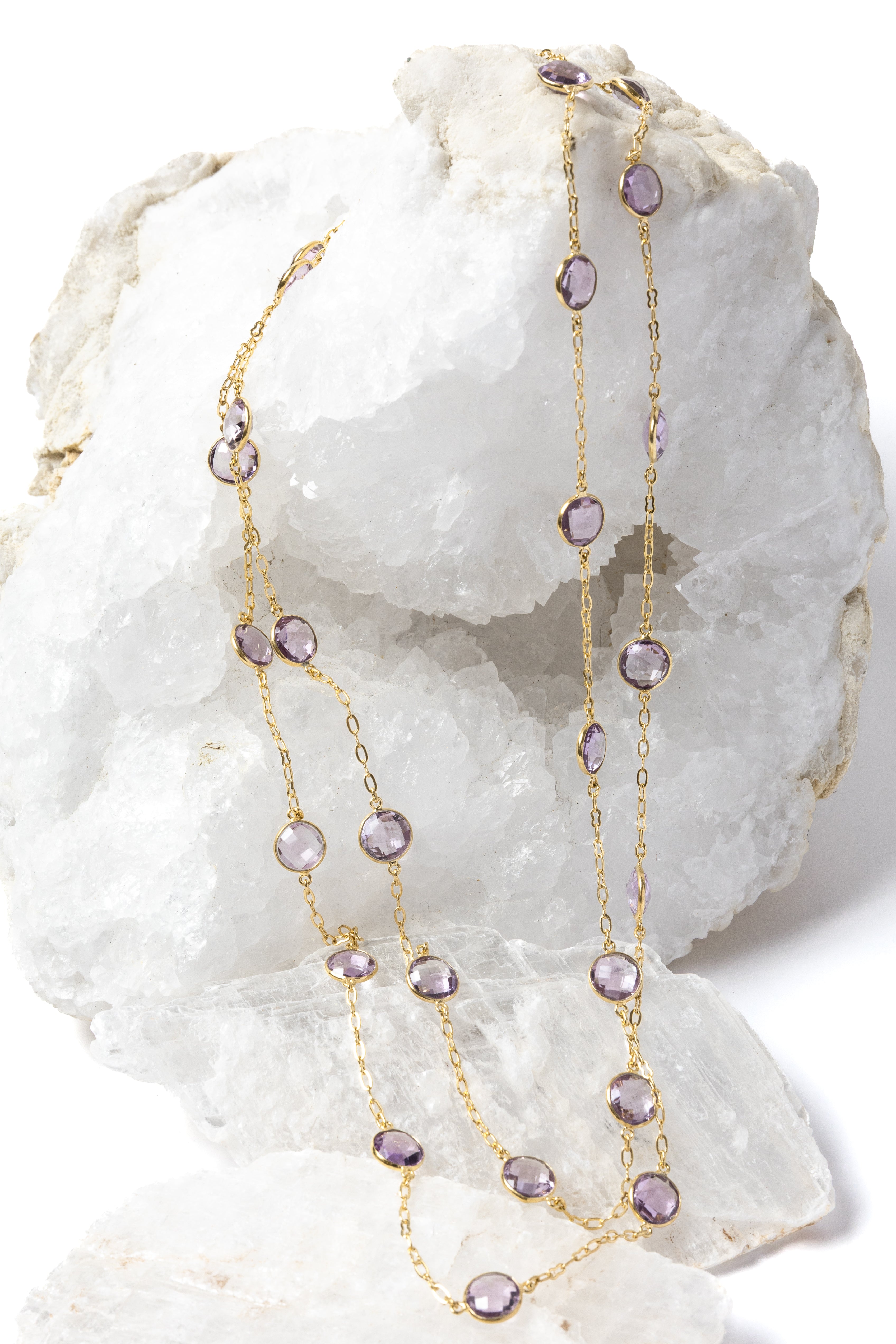 
Violet Mist gold station necklace with clear, translucent lavender amethyst stones, styled in two strands to showcase its versatile, layered wear.