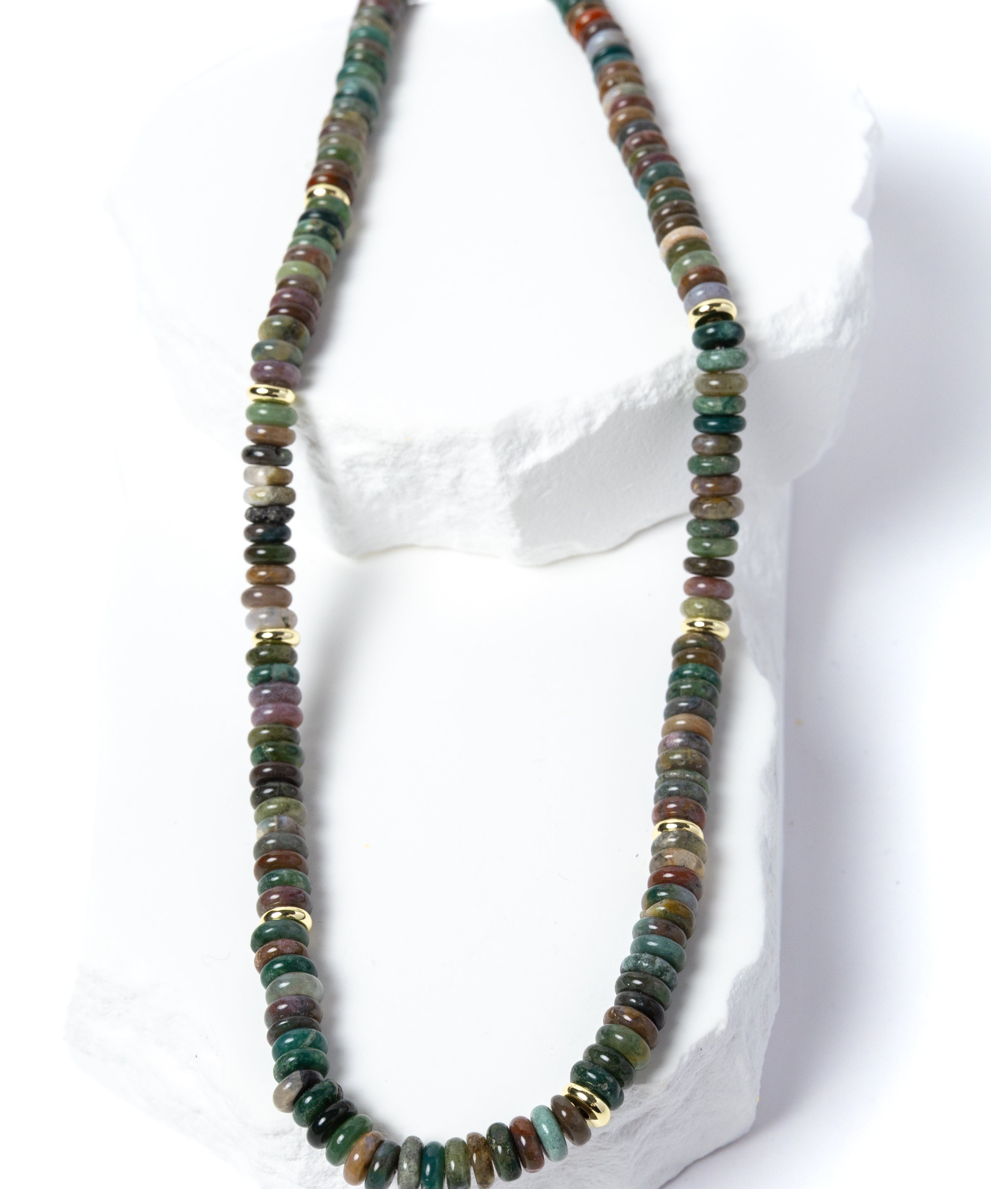 Luxury handcrafted multicolor gemstone necklace featuring polished rondelle beads in rich earthy green, teal, brown, plum, and muted natural tones with gold accents.