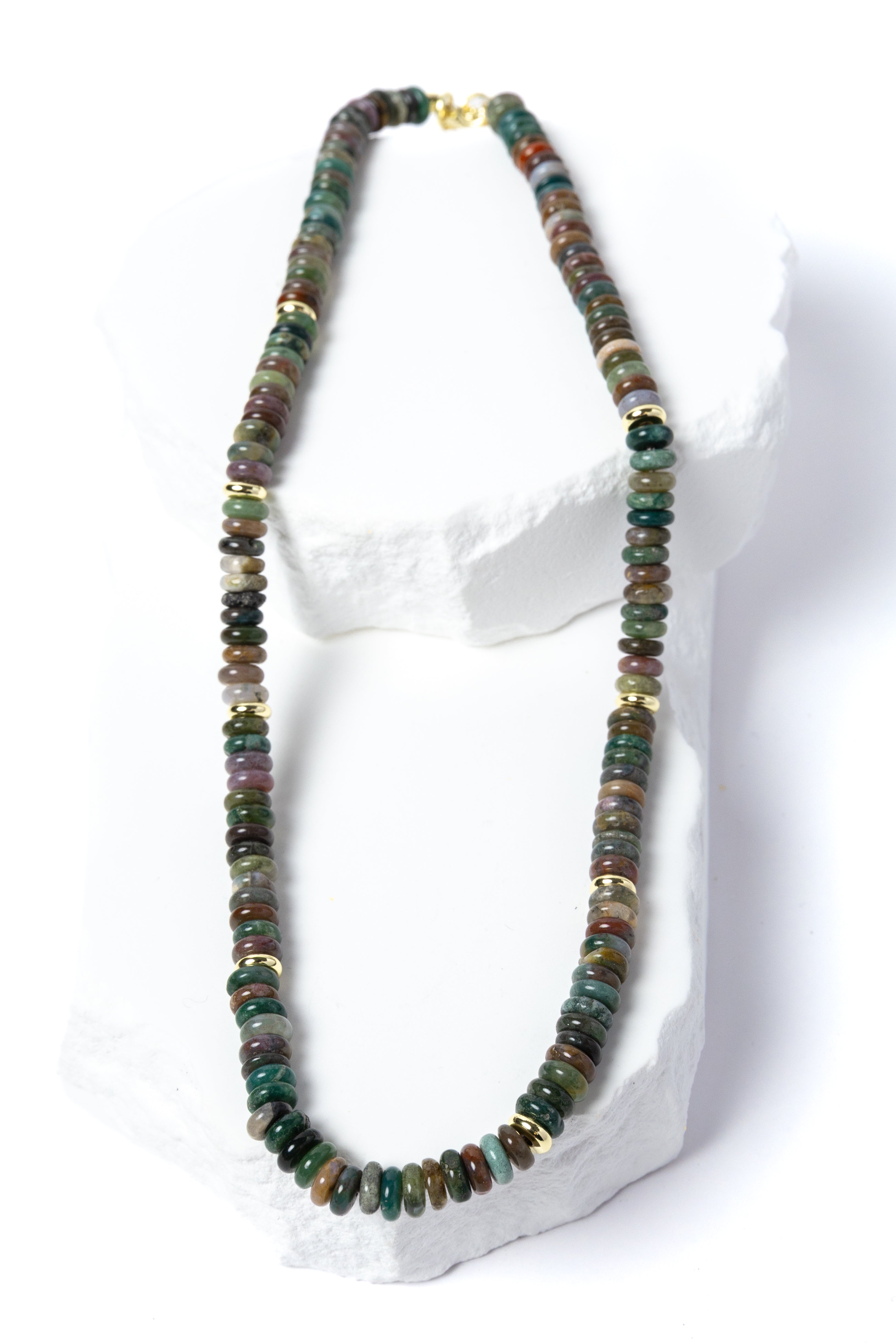 Luxury handcrafted multicolor gemstone necklace featuring polished rondelle beads in rich earthy green, teal, brown, plum, and muted natural tones with gold accents.