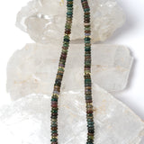 Elegant multicolor gemstone strand necklace composed of smooth natural stone rondelles with organic earth-toned variations and polished gold spacer accents.