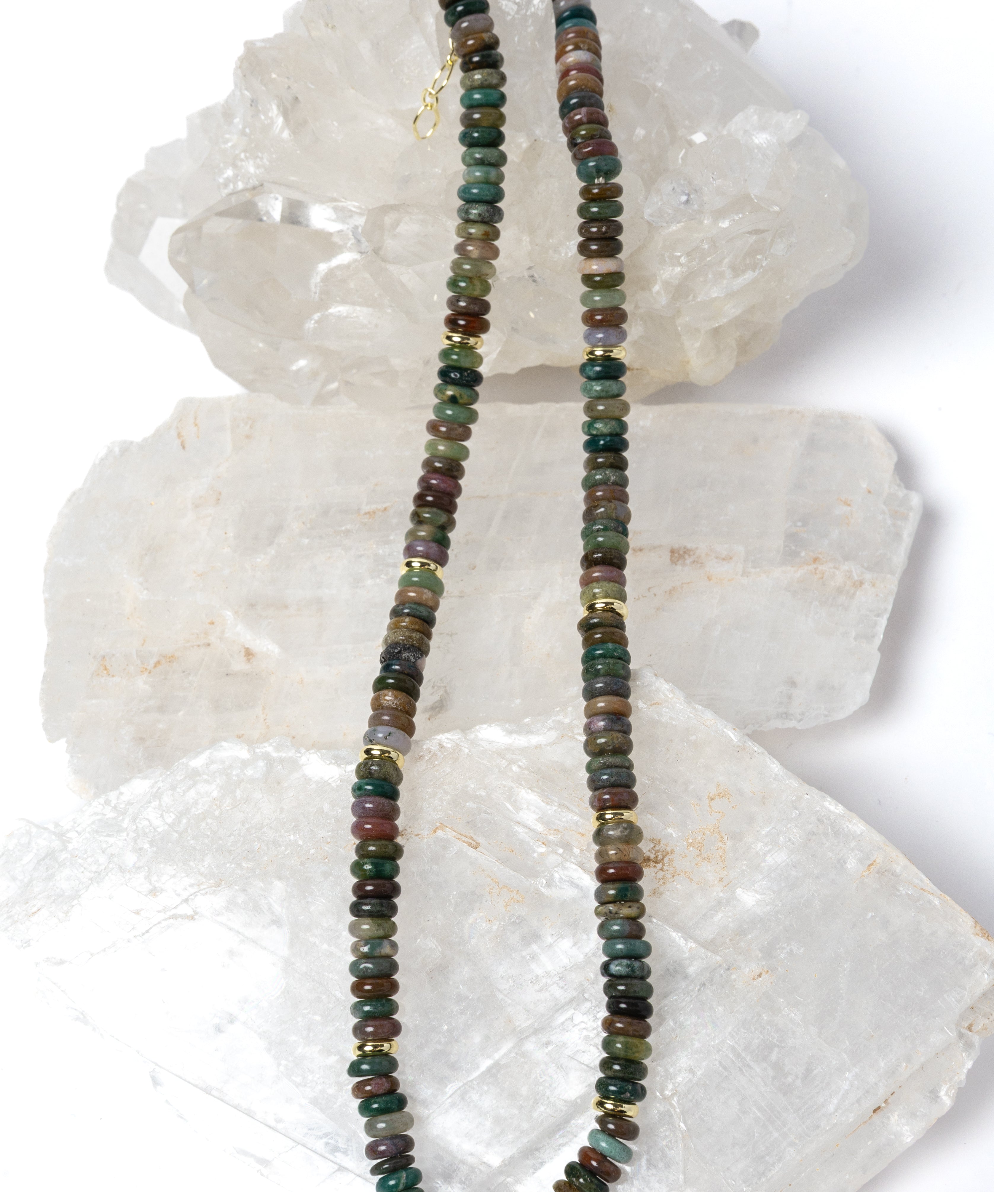 Elegant multicolor gemstone strand necklace composed of smooth natural stone rondelles with organic earth-toned variations and polished gold spacer accents.
