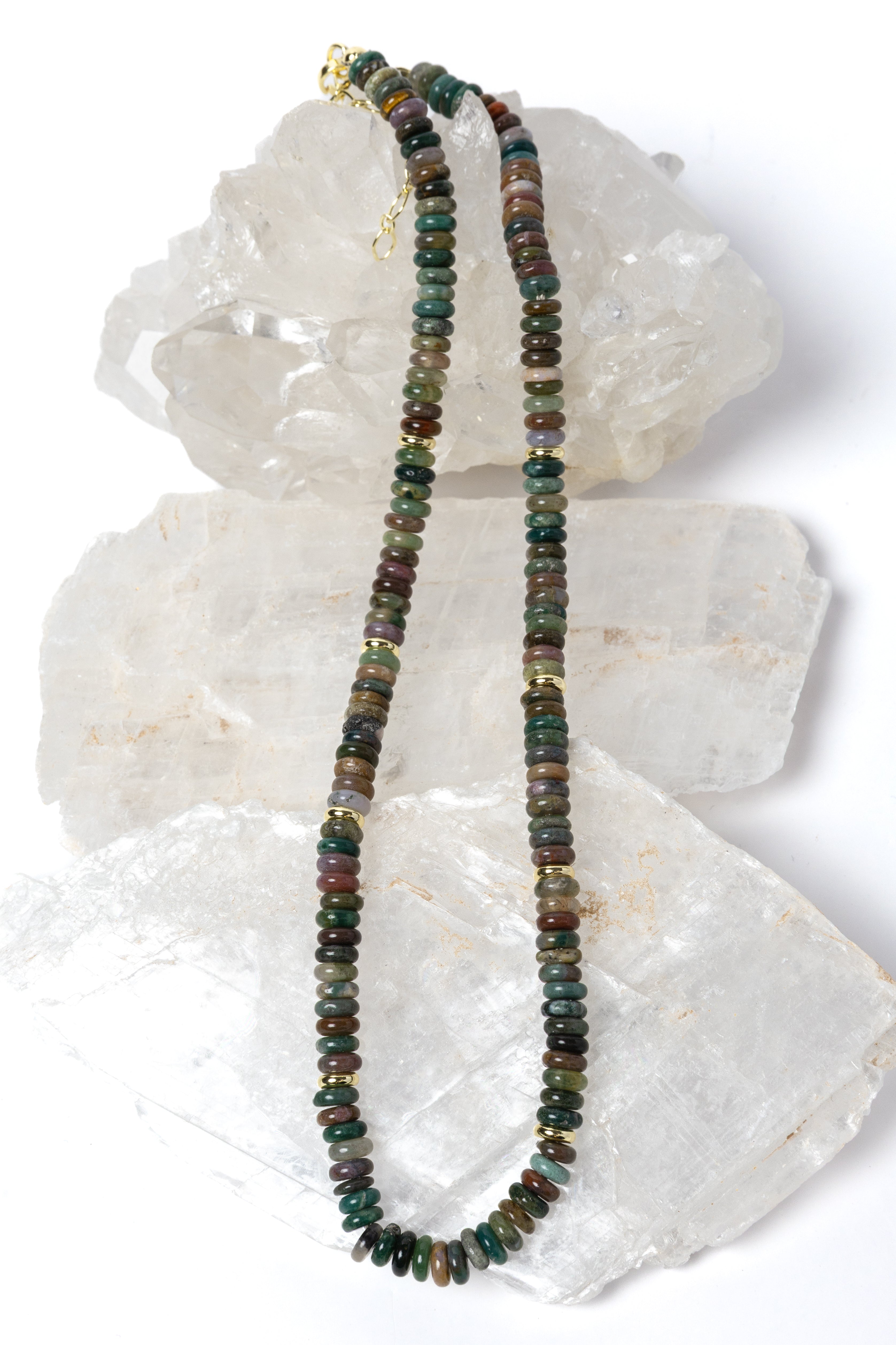 Elegant multicolor gemstone strand necklace composed of smooth natural stone rondelles with organic earth-toned variations and polished gold spacer accents.