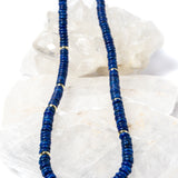 Luxury handcrafted lapis lazuli necklace featuring deep midnight-blue lapis rondelles with polished gold-plated spacer accents and an elegant minimalist silhouette.