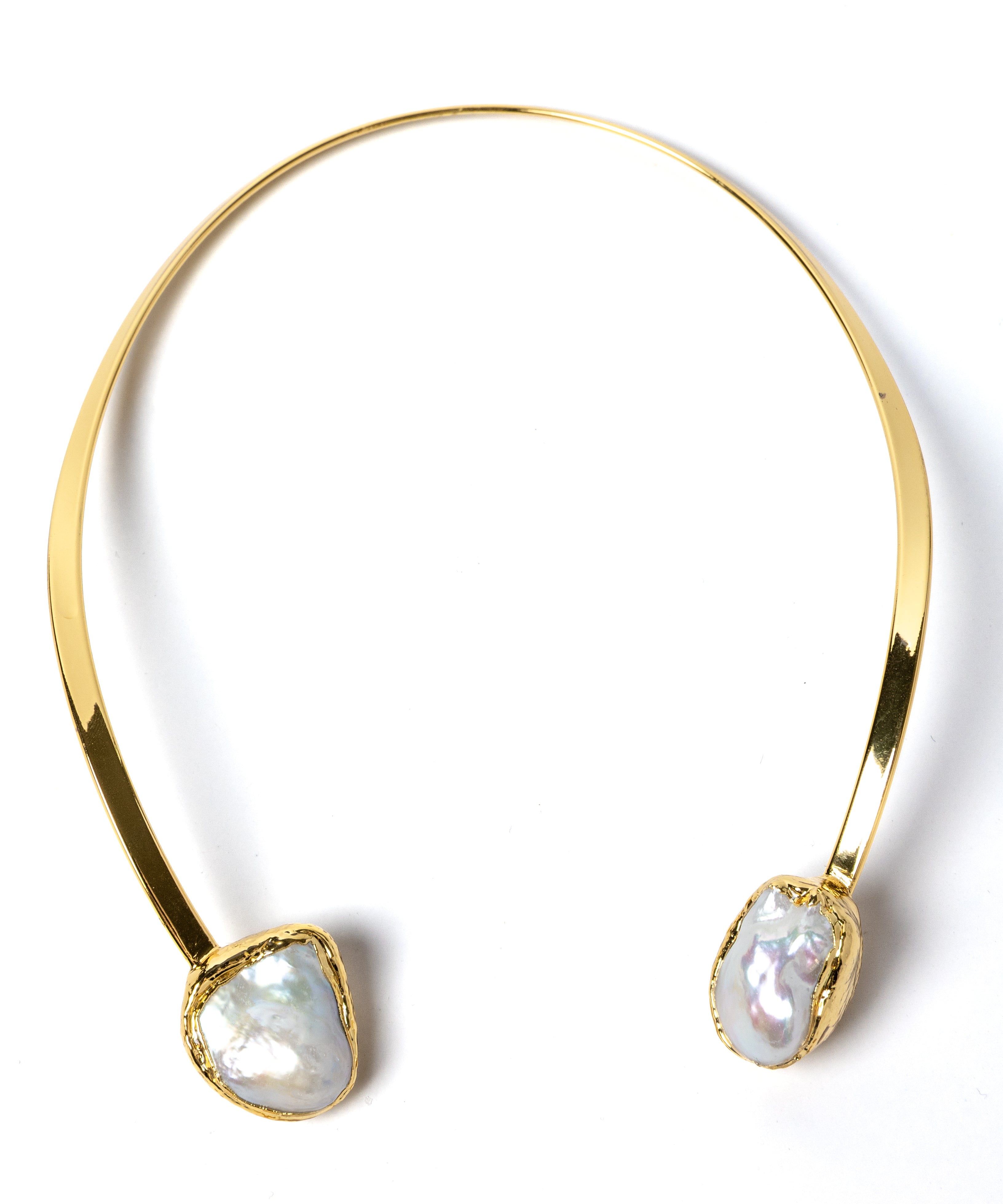 Luxury sculptural open-front collar necklace featuring two substantial natural baroque pearls suspended from a polished gold-plated curved structure with a refined contemporary silhouette.