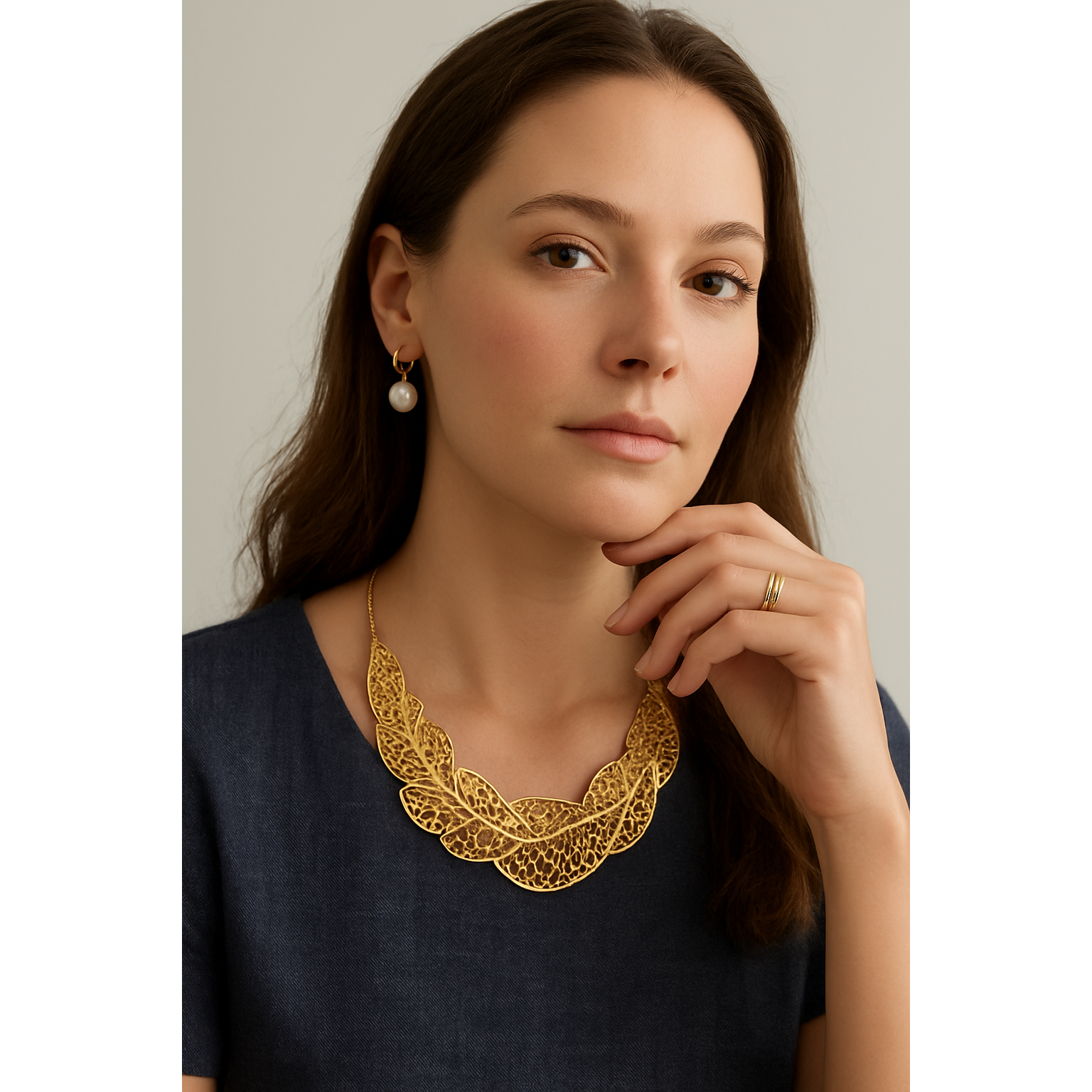 18k gold-plated sculptural leaf statement necklace featuring intricate botanical detailing, versatile enough for effortless daytime wear and elegant evening styling.