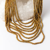 Close-up of Pearl Opulence Necklace highlighting the natural luster, rich honey-gold and champagne tones, subtle olive-green undertones, and organic shapes of the approximately 6–7 mm freshwater potato pearls.