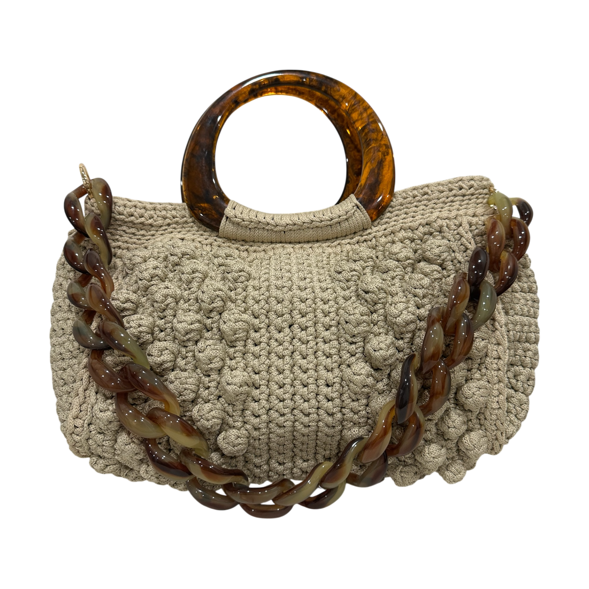 Hand-crocheted Paloma handbag in a soft nude-beige tone with textured stitching, featuring a sculptural resin top handle and a coordinating chain strap.