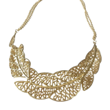18k gold-plated statement necklace featuring layered sculptural leaf elements with openwork detailing and adjustable chain styling.