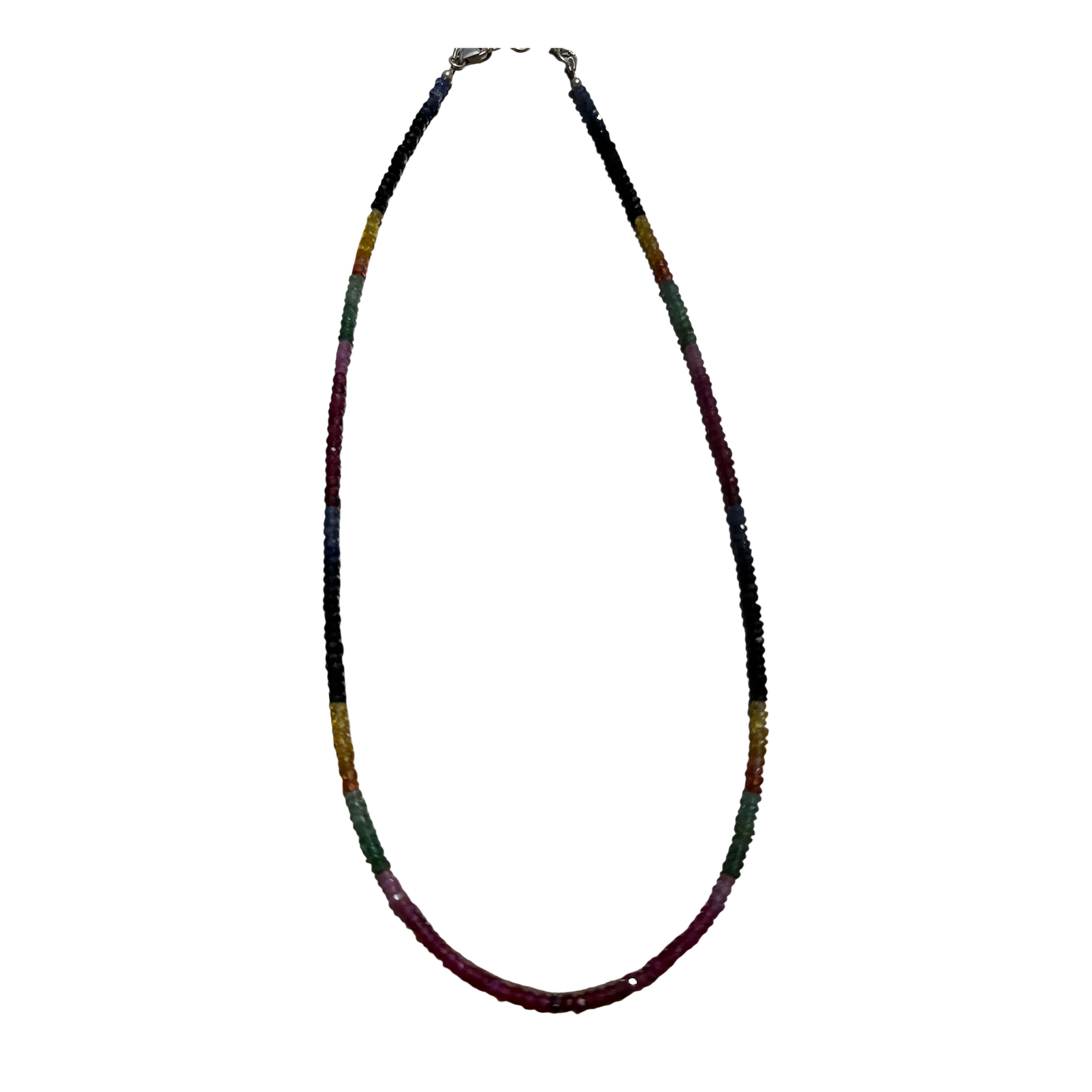Luxury handcrafted multicolor gemstone necklace featuring natural rubies, emeralds, yellow sapphires, and blue sapphires in delicate faceted rondelles with sterling silver clasp and extension.