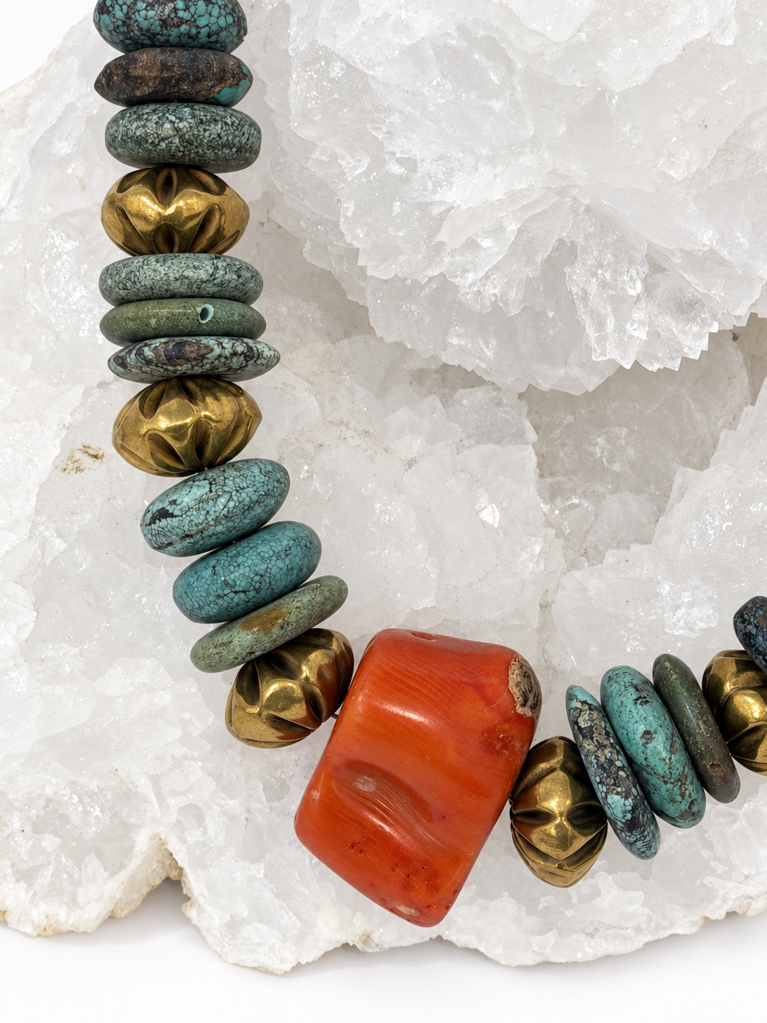 Close-up of Atlantis necklace with natural turquoise, vintage coral centerpiece and aged-gold vintage brass beads