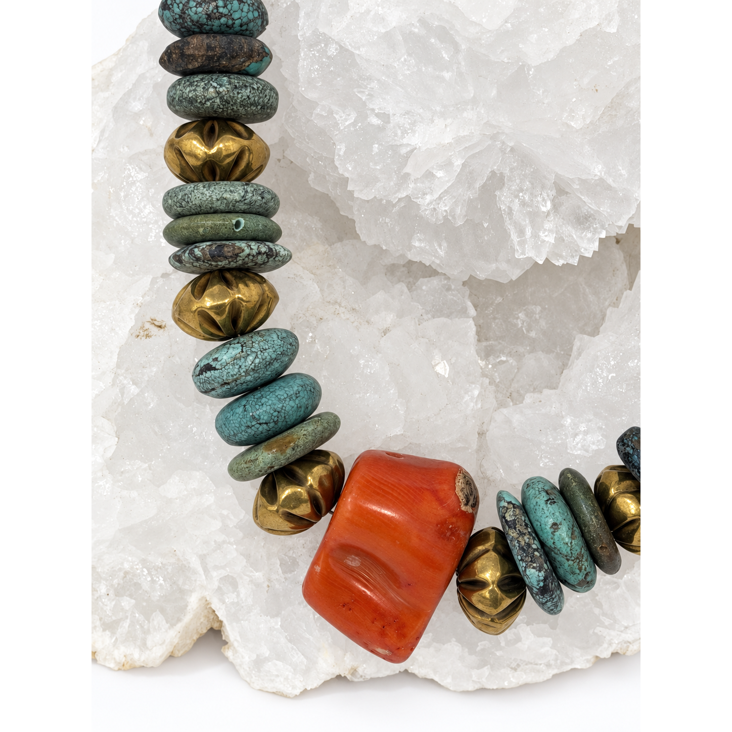 Close-up of Atlantis necklace with natural turquoise, vintage coral centerpiece and aged-gold vintage brass beads