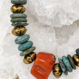 Close-up of Atlantis necklace with natural turquoise, vintage coral centerpiece and aged-gold vintage brass beads