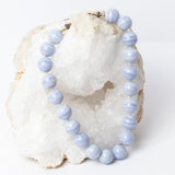 Blue lace agate statement necklace with large round stones, soft blue and white banding, individual knots, and a sterling silver clasp.