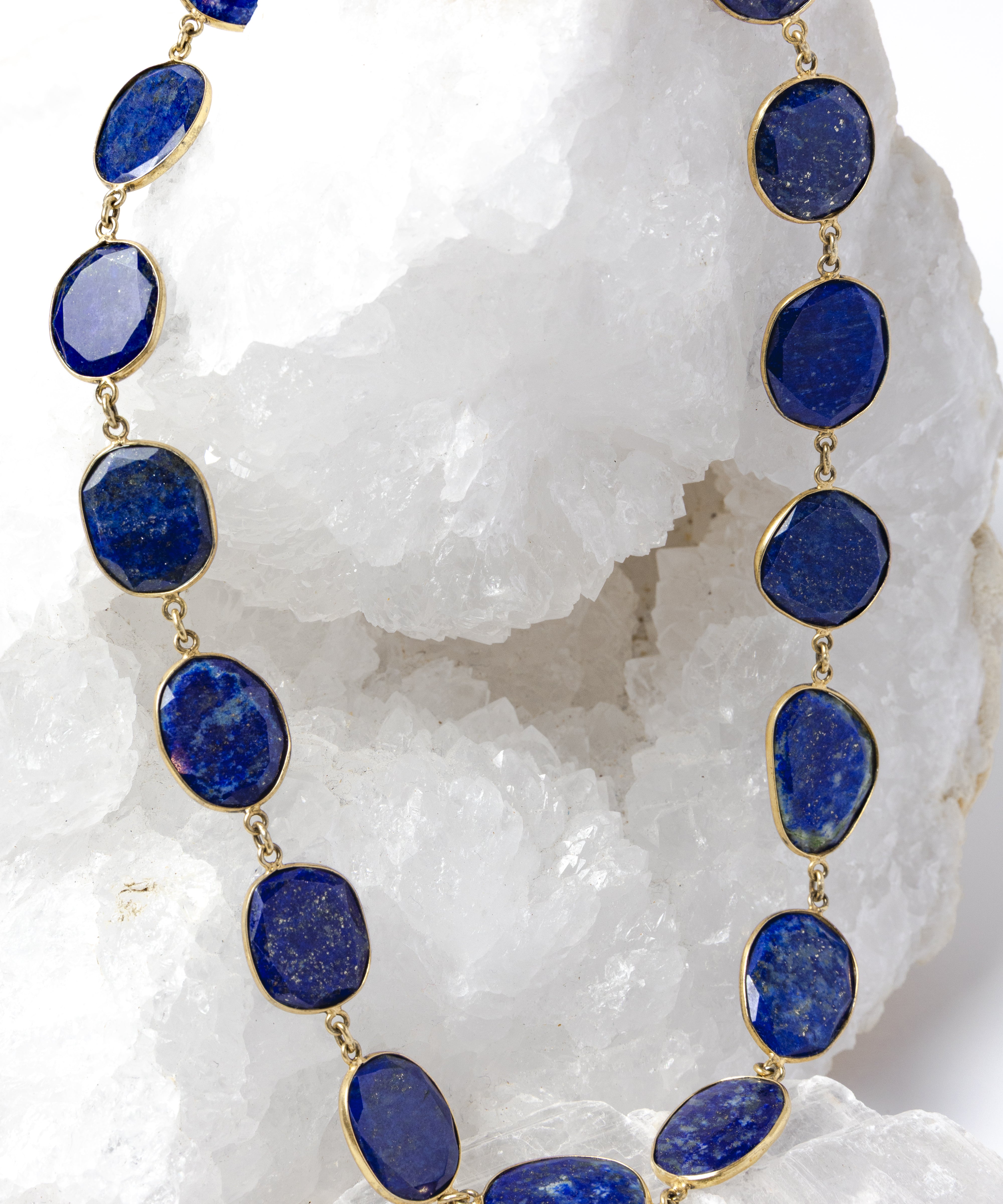 Natural lapis lazuli statement necklace featuring faceted royal-blue gemstones with natural pyrite inclusions set in vermeil bezels.