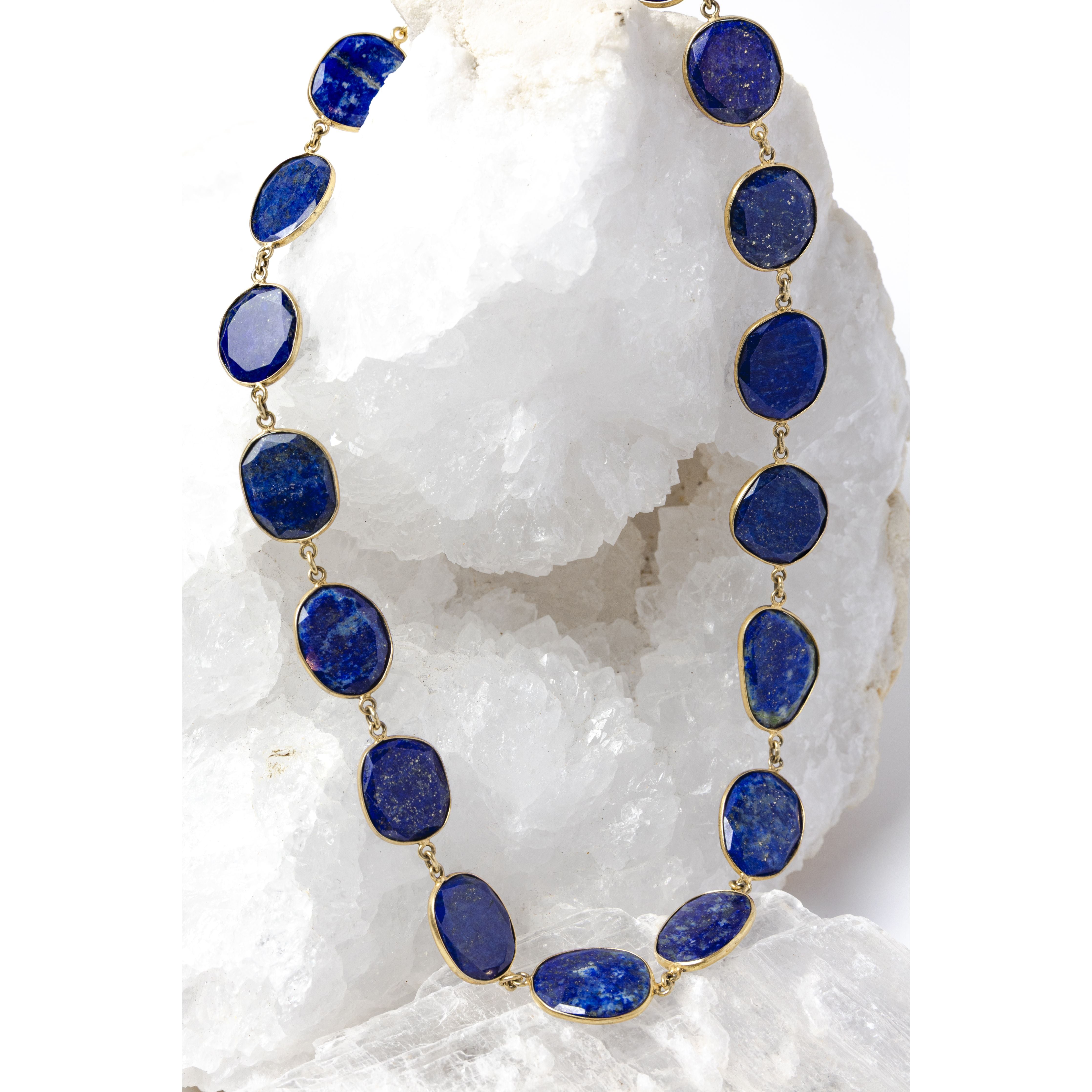 Natural lapis lazuli statement necklace featuring faceted royal-blue gemstones with natural pyrite inclusions set in vermeil bezels.