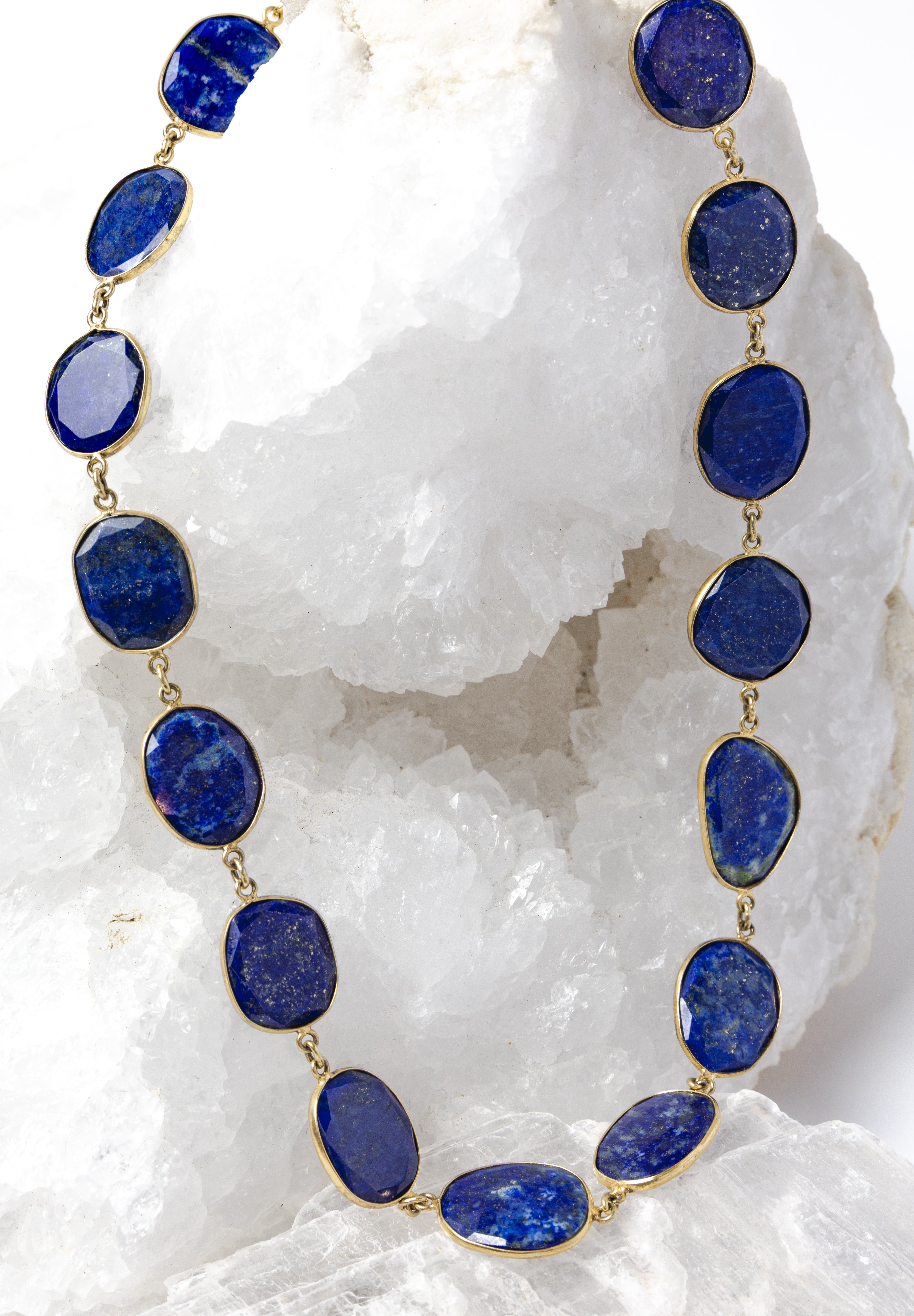 Natural lapis lazuli statement necklace featuring faceted royal-blue gemstones with natural pyrite inclusions set in vermeil bezels.