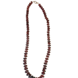 One-of-a-kind 715-carat garnet necklace featuring richly saturated graduated garnet rondelles in deep wine hues, elegantly arranged in a 22-inch silhouette and finished with a sterling silver clasp.