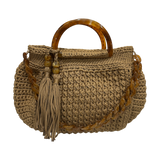 Giselle Honeydune handbag, hand-crocheted beige luxury bag with resin handle, tassel detail and chain strap for elegant day-to-evening wear