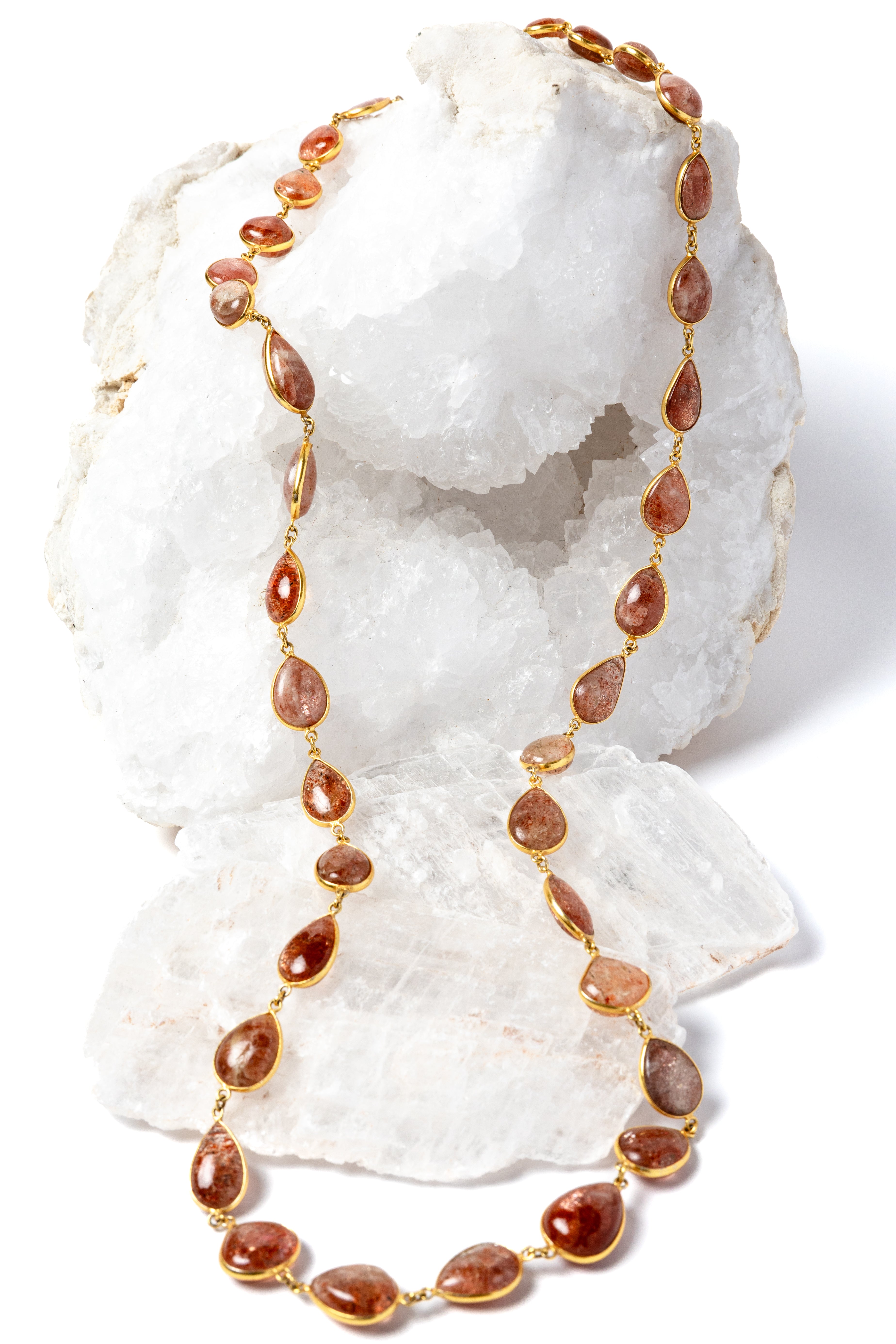     Copper Rain 35-inch natural sunstone necklace with gold-plated settings and warm copper, peach, and amber tones.