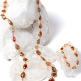     Copper Rain sunstone necklace displayed with matching bracelet for styling; bracelet sold separately.