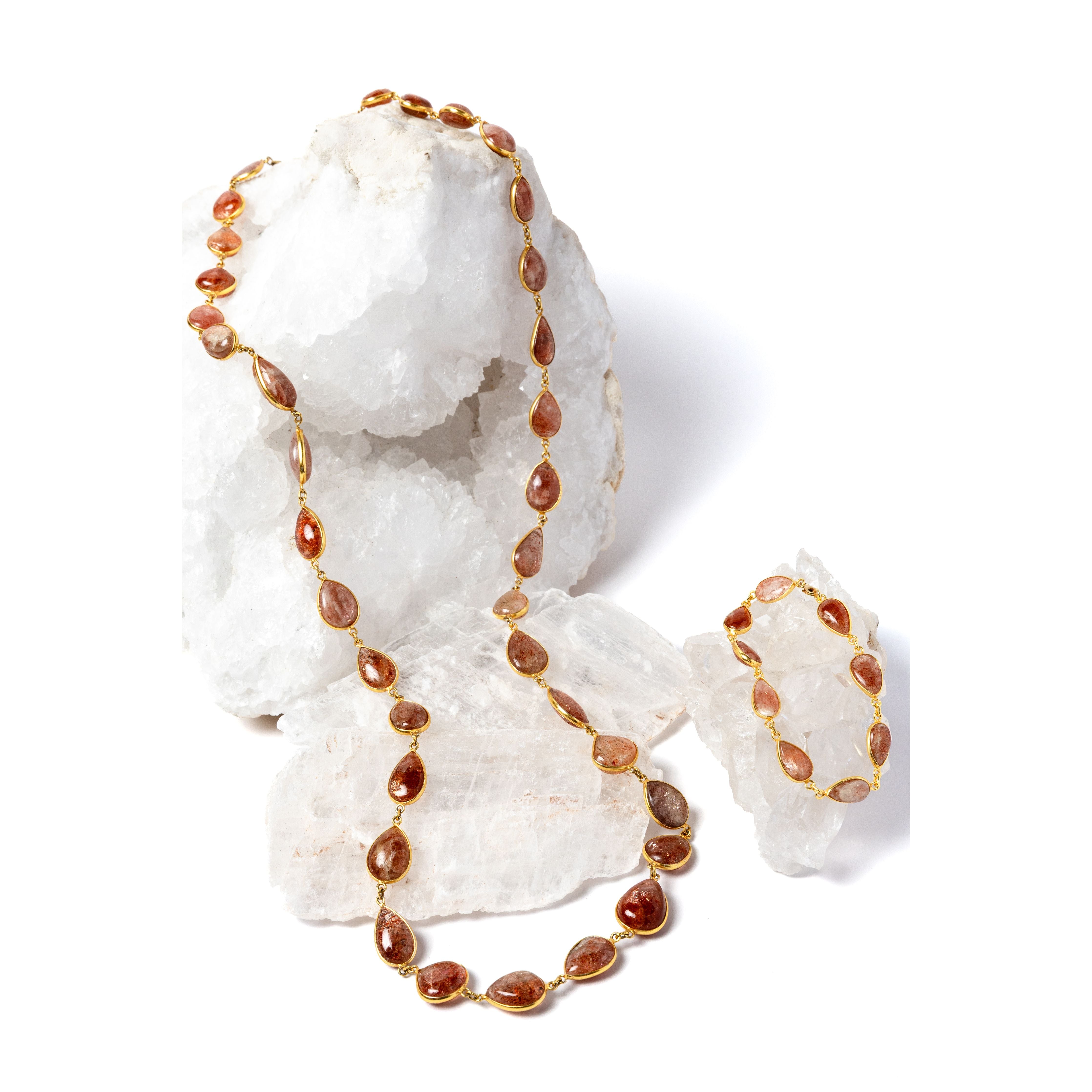     Copper Rain sunstone necklace displayed with matching bracelet for styling; bracelet sold separately.
