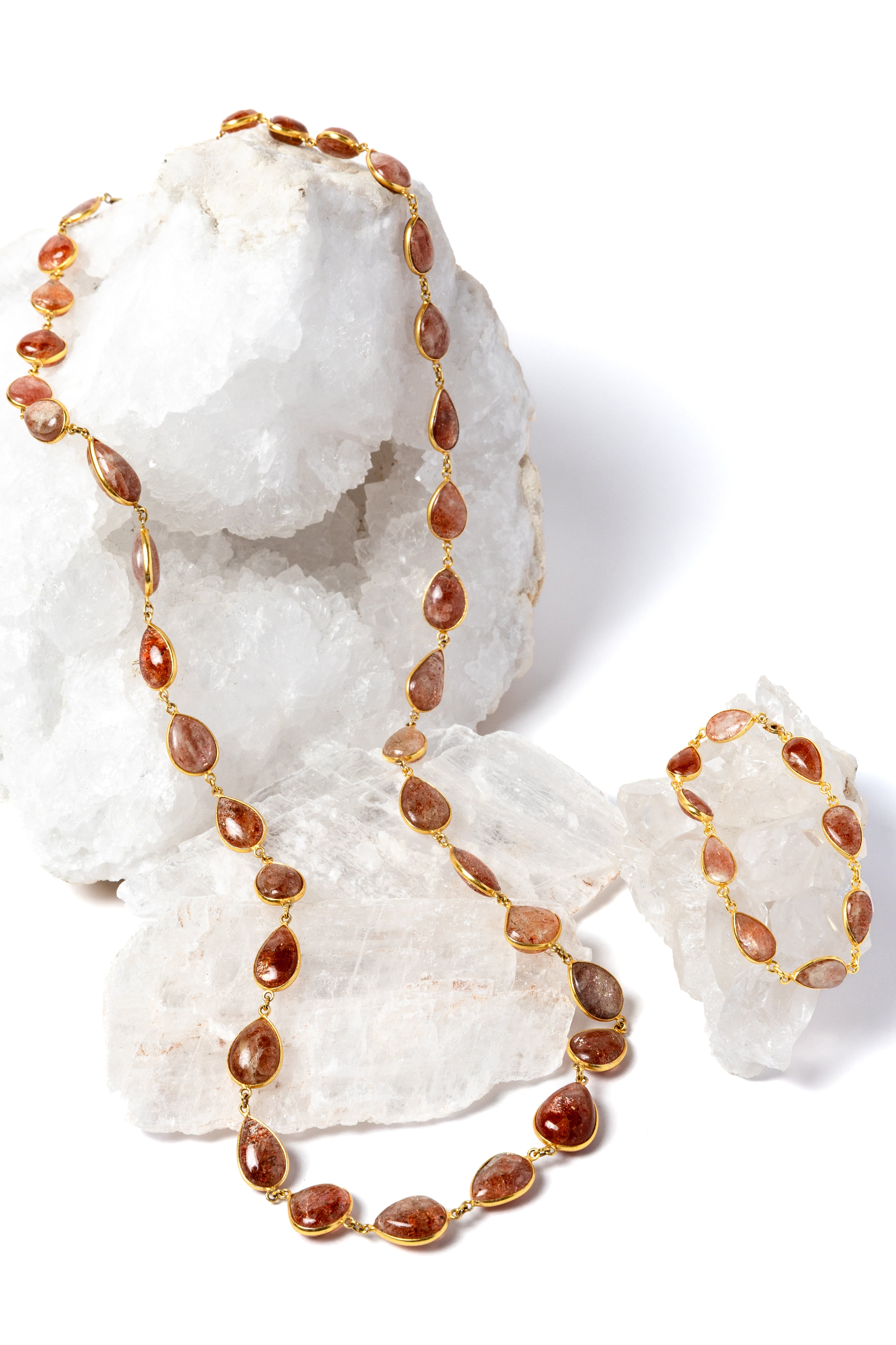    Copper Rain sunstone necklace displayed with matching bracelet for styling; bracelet sold separately.