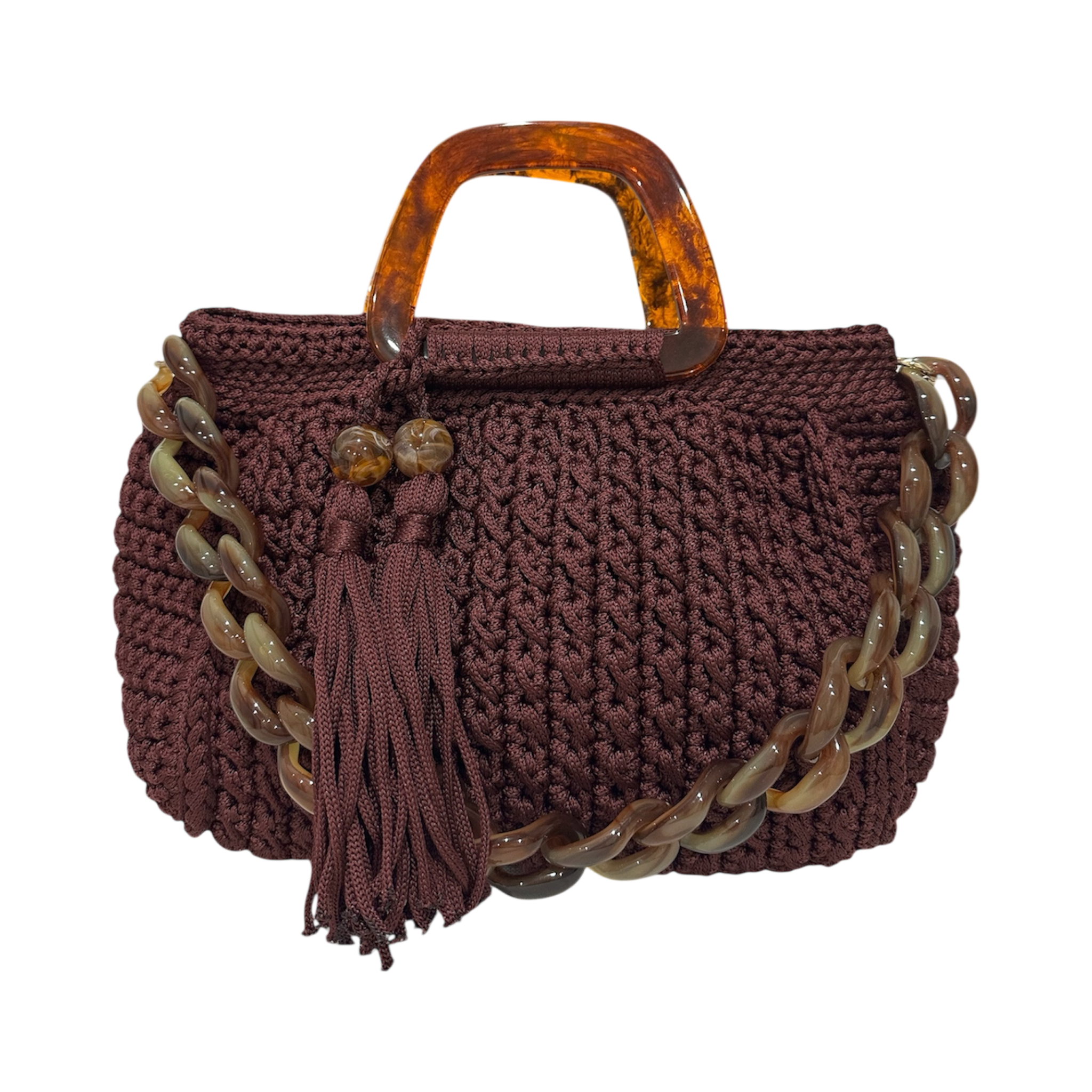 Hand-crocheted Giselle handbag in a deep bordeaux tone with dimensional vertical textured stitching, featuring marbled amber resin round handles, a coordinating chain strap, and tassel accents.