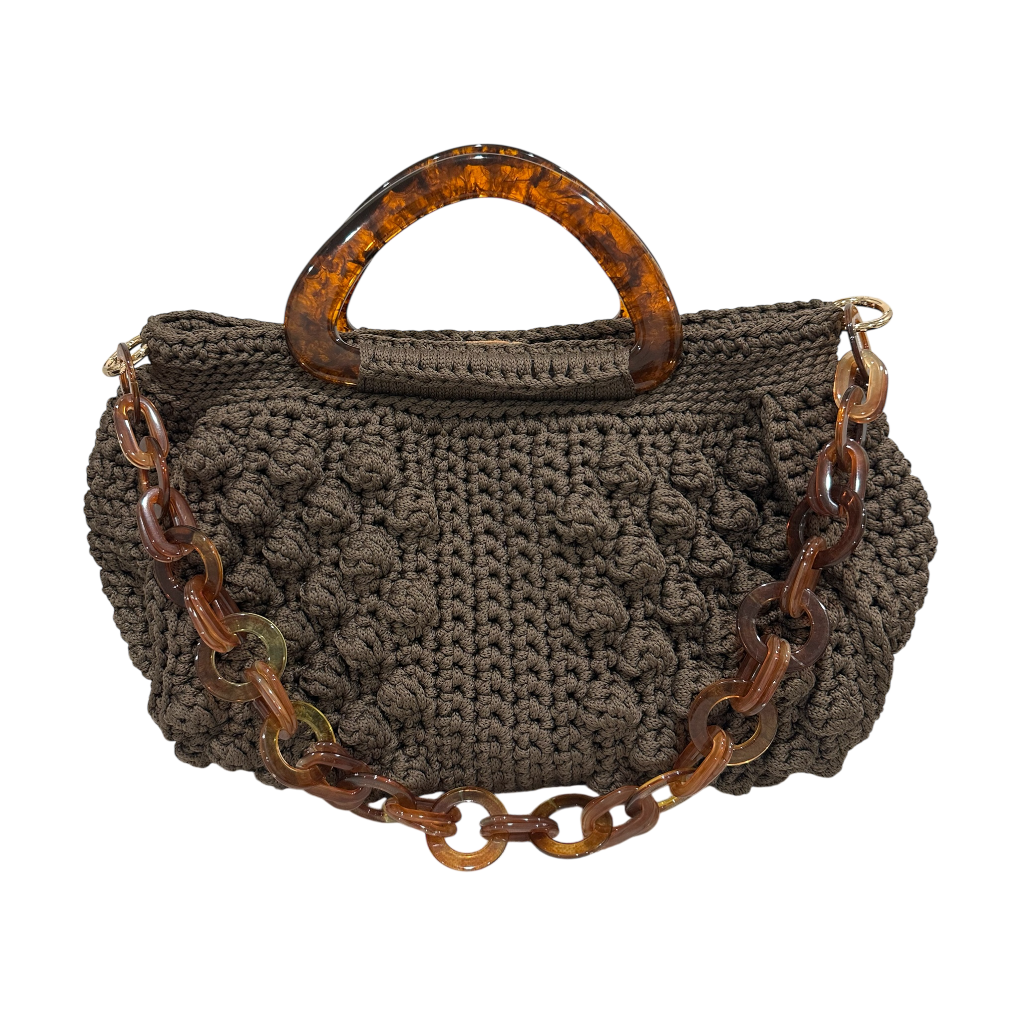Hand-crocheted Paloma handbag in warm earth tones with dimensional texture, featuring sculptural amber-marbled resin handles and a coordinating resin chain strap.