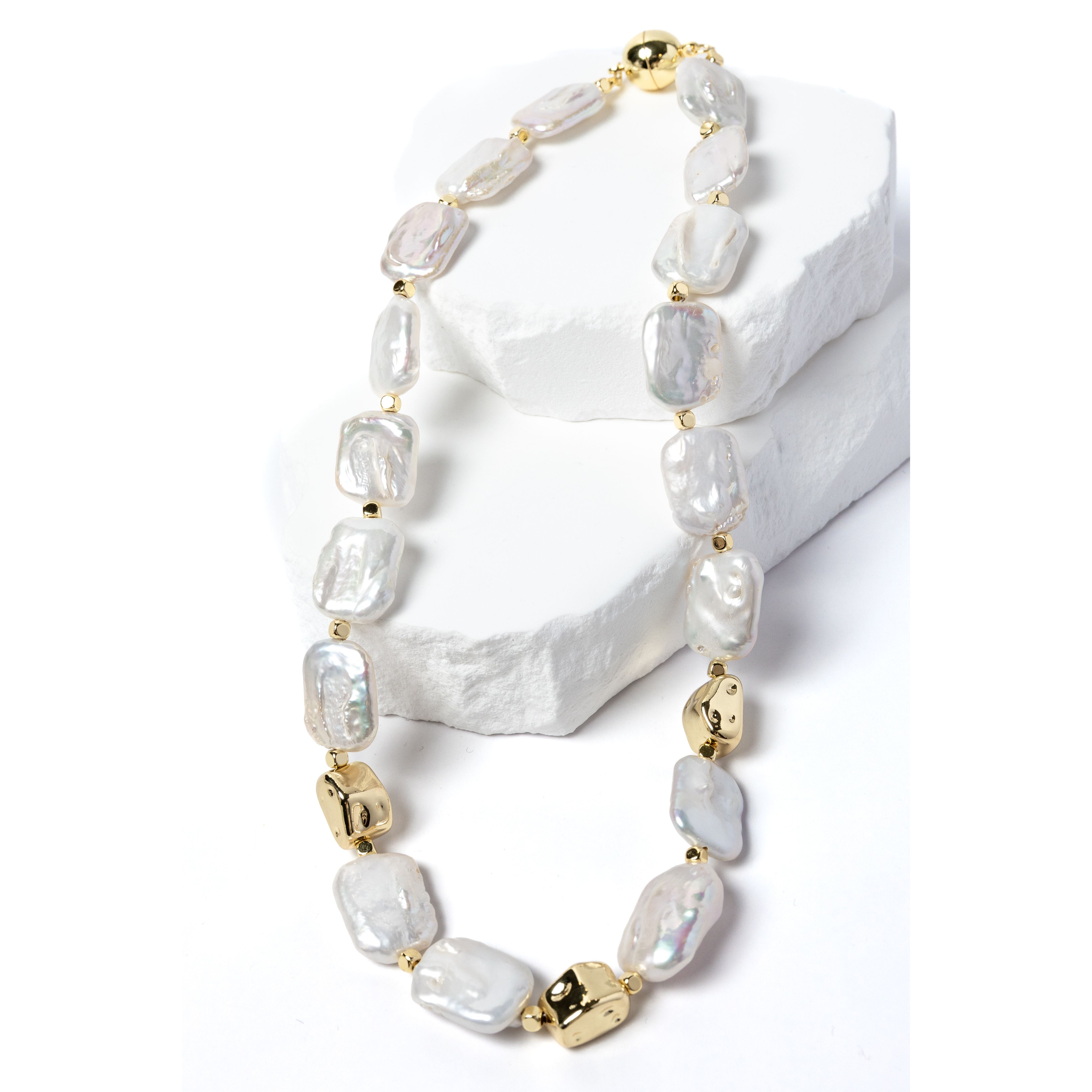 Luxury flat baroque freshwater pearl necklace featuring high-luster organically shaped pearls, gold-plated accents, and an elegant timeless design.