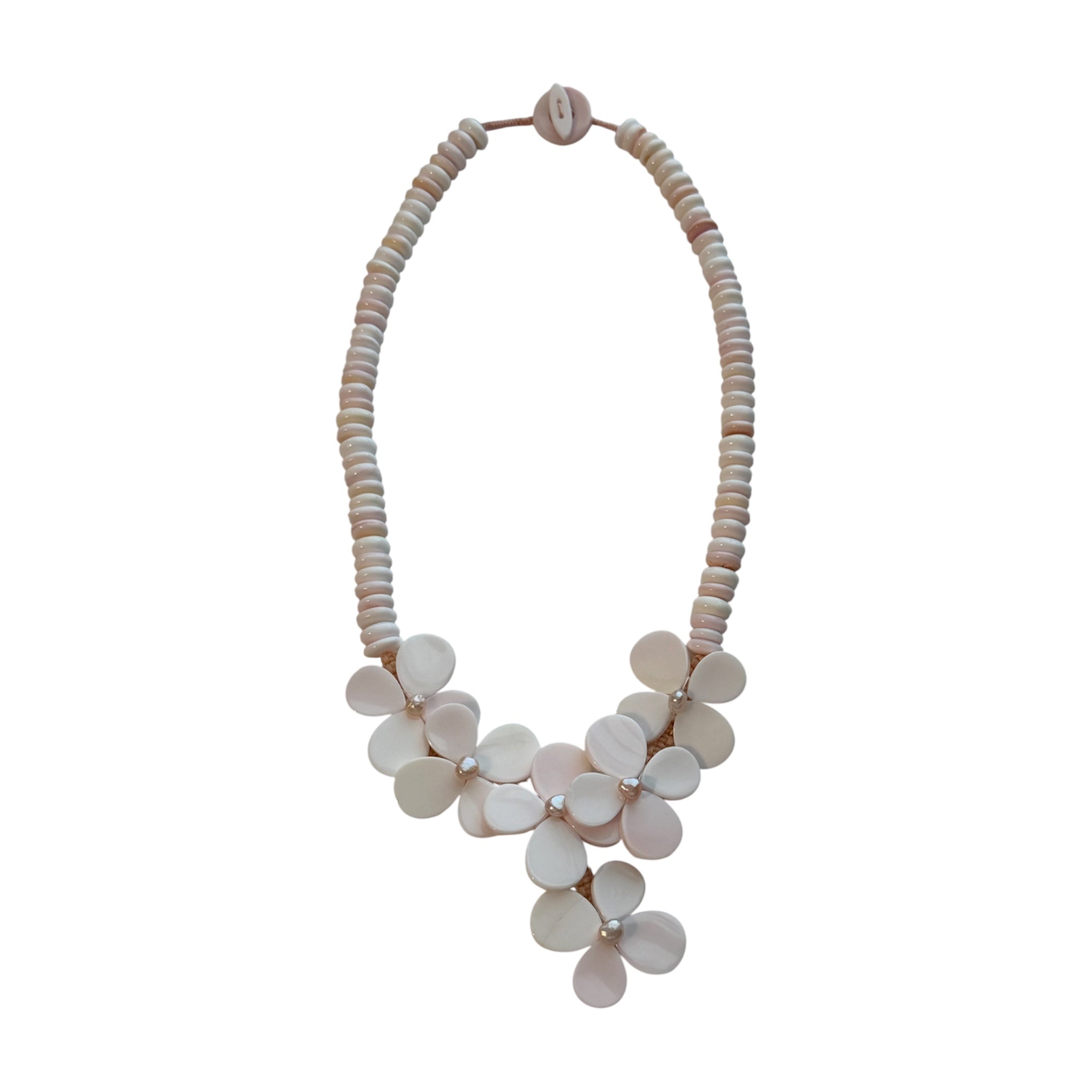 Flor del Mar conch shell and freshwater pearl necklace featuring sculptural floral motifs handcrafted from natural blush conch shell and freshwater pearls.