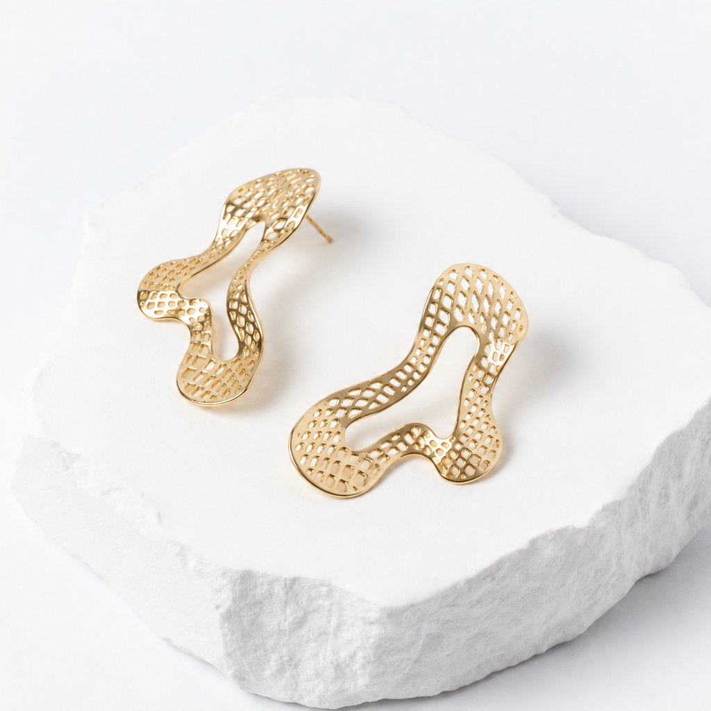 Free Spirit gold-tone earrings featuring flowing, organic free-form silhouettes and delicate open-mesh detailing.