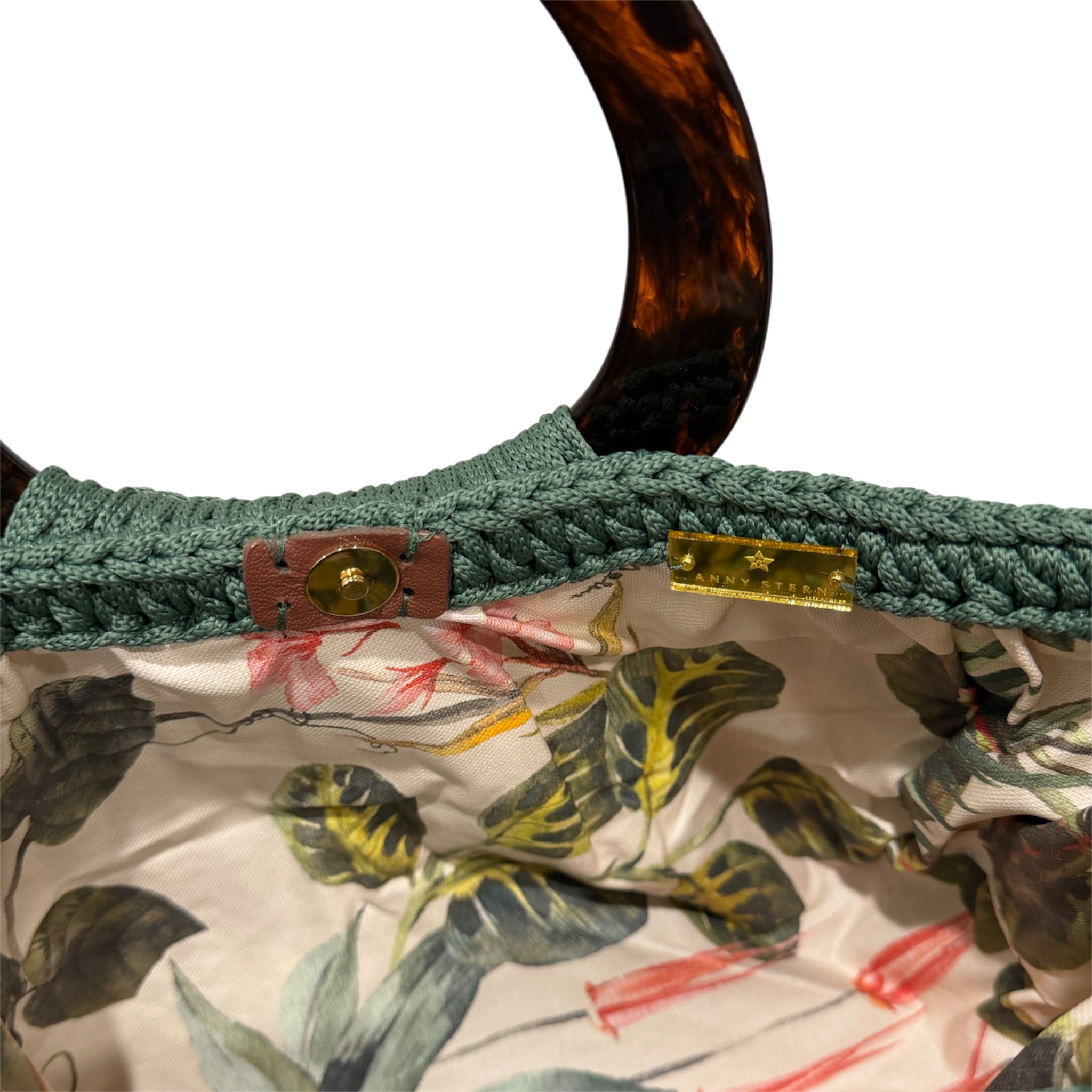 Tropical botanical lining inside the Giselle Bag Emerald Oasis featuring lush foliage motifs and natural-inspired details