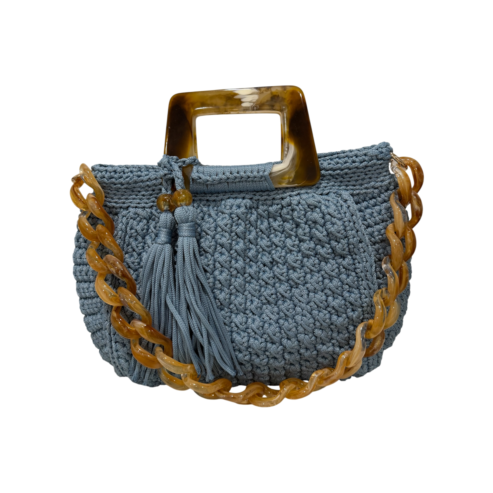Light blue hand-crocheted Giselle handbag with tortoiseshell resin handle, coordinating chain strap, and tassel detail