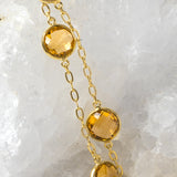 Close-up of the Golden Hour Citrine Necklace highlighting exceptional faceted citrine gemstones, gold-plated bezel settings, and the rich golden color that defines this timeless design.