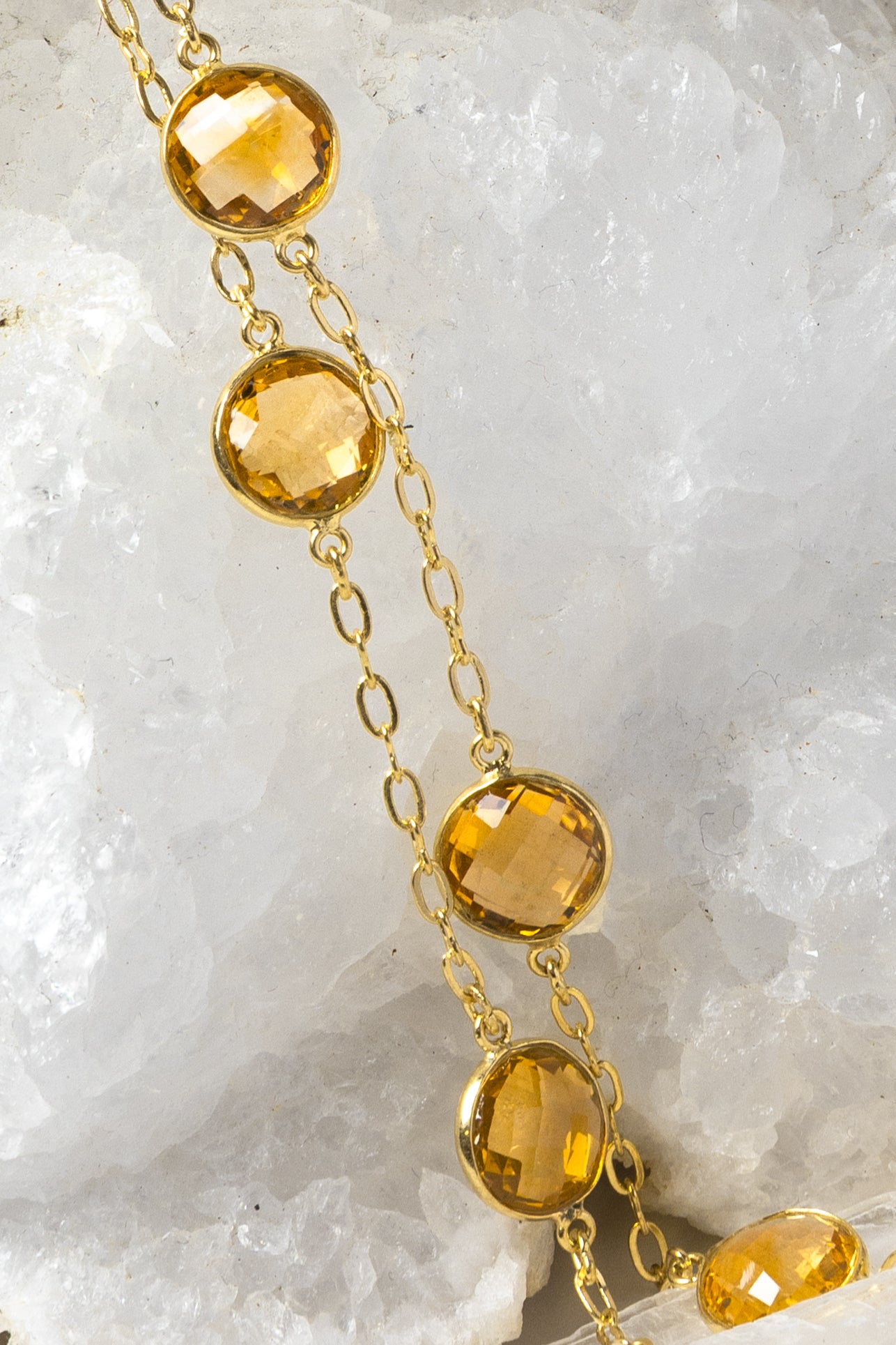 Close-up of the Golden Hour Citrine Necklace highlighting exceptional faceted citrine gemstones, gold-plated bezel settings, and the rich golden color that defines this timeless design.