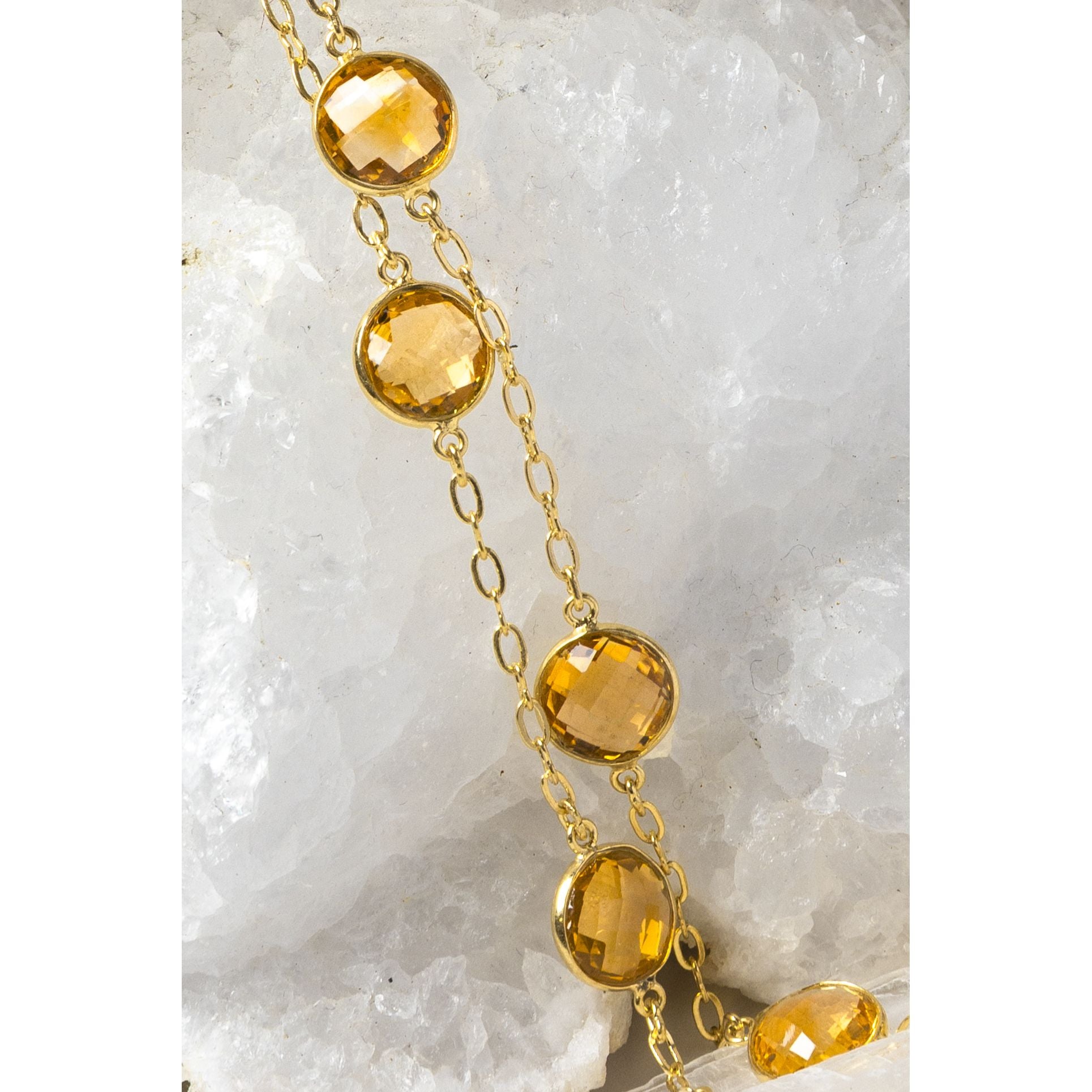 Close-up of the Golden Hour Citrine Necklace highlighting exceptional faceted citrine gemstones, gold-plated bezel settings, and the rich golden color that defines this timeless design.