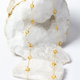 Golden Hour Citrine Necklace featuring natural faceted citrine gemstones in gold-plated bezel settings, styled as a graceful long necklace with radiant golden color and timeless elegance.