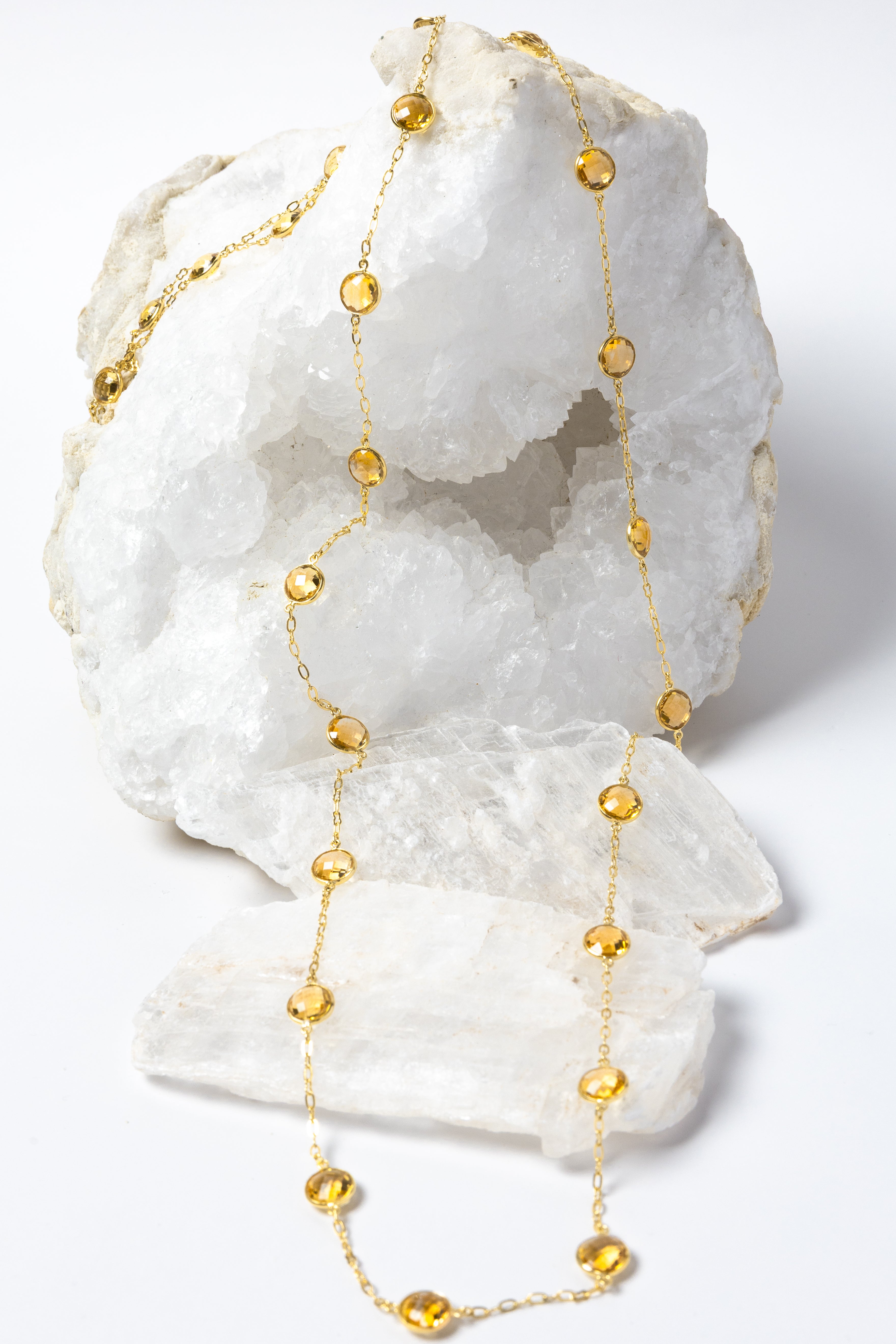 Golden Hour Citrine Necklace featuring natural faceted citrine gemstones in gold-plated bezel settings, styled as a graceful long necklace with radiant golden color and timeless elegance.