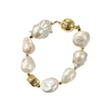 Golden Luna statement bracelet featuring large natural baroque pearls with luminous organic surfaces and sculptural gold-plated accents.