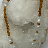 Golden Velvet necklace featuring deep golden citrine rondelles and a concentrated arrangement of natural baroque pearls across the front.